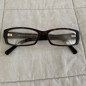 Prada tortoise glasses.